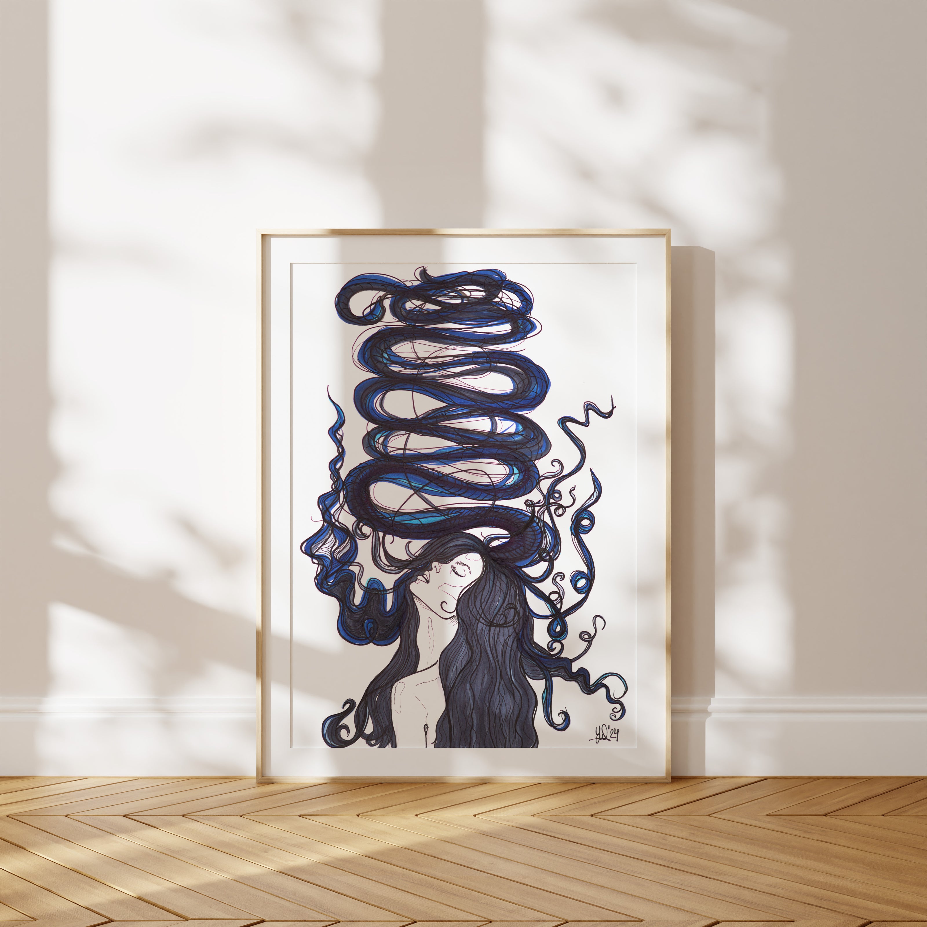 Framed artwork of a woman with flowing hair on a white wall. A piece on mental wellness and anxiety in perimenopause.