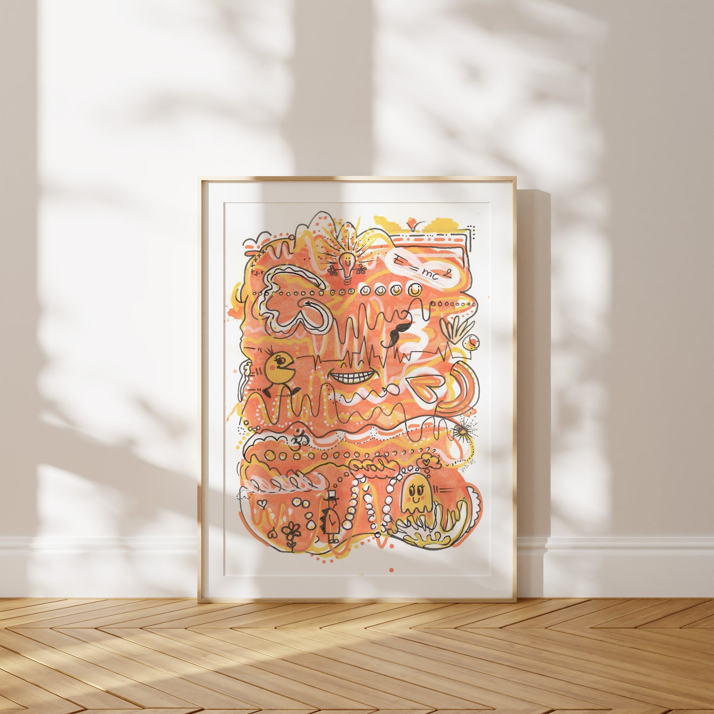 Framed abstract artwork with orange and yellow colors on a white wall. A piece on Energy and Positivity.